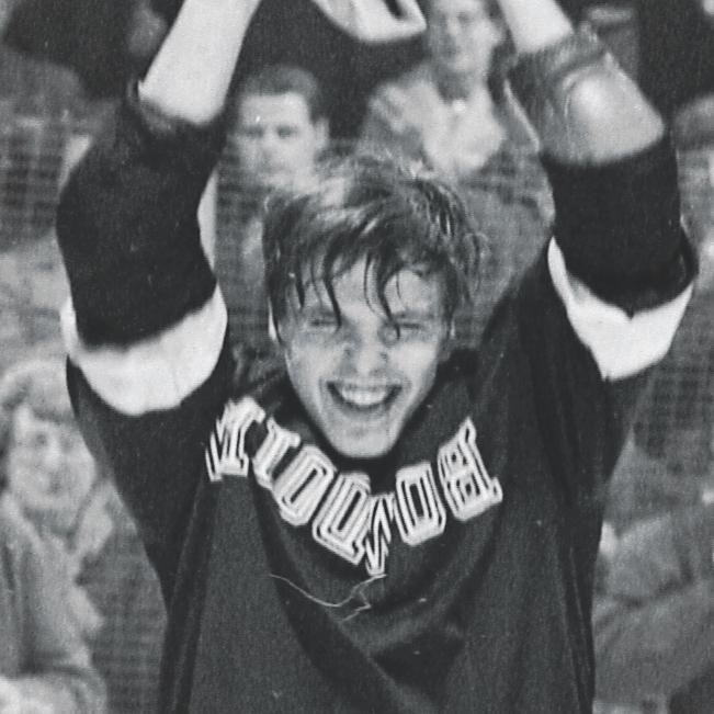 Ed Good holding up a trophy